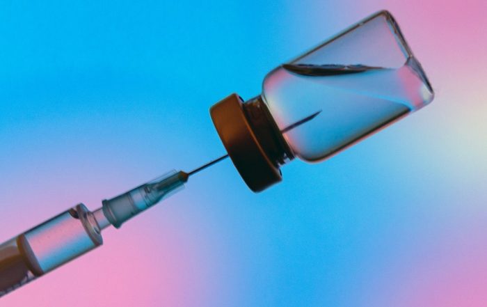 Experts Debate Vaccine Efficacy Against Omicron Variant